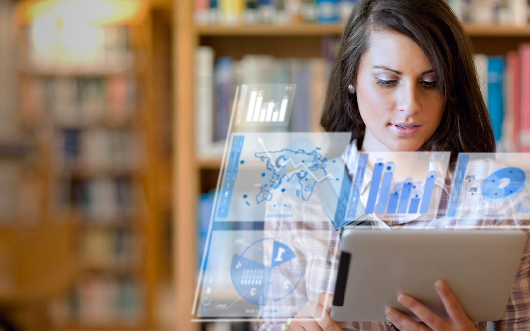 Woman reviewing charts and graphs.